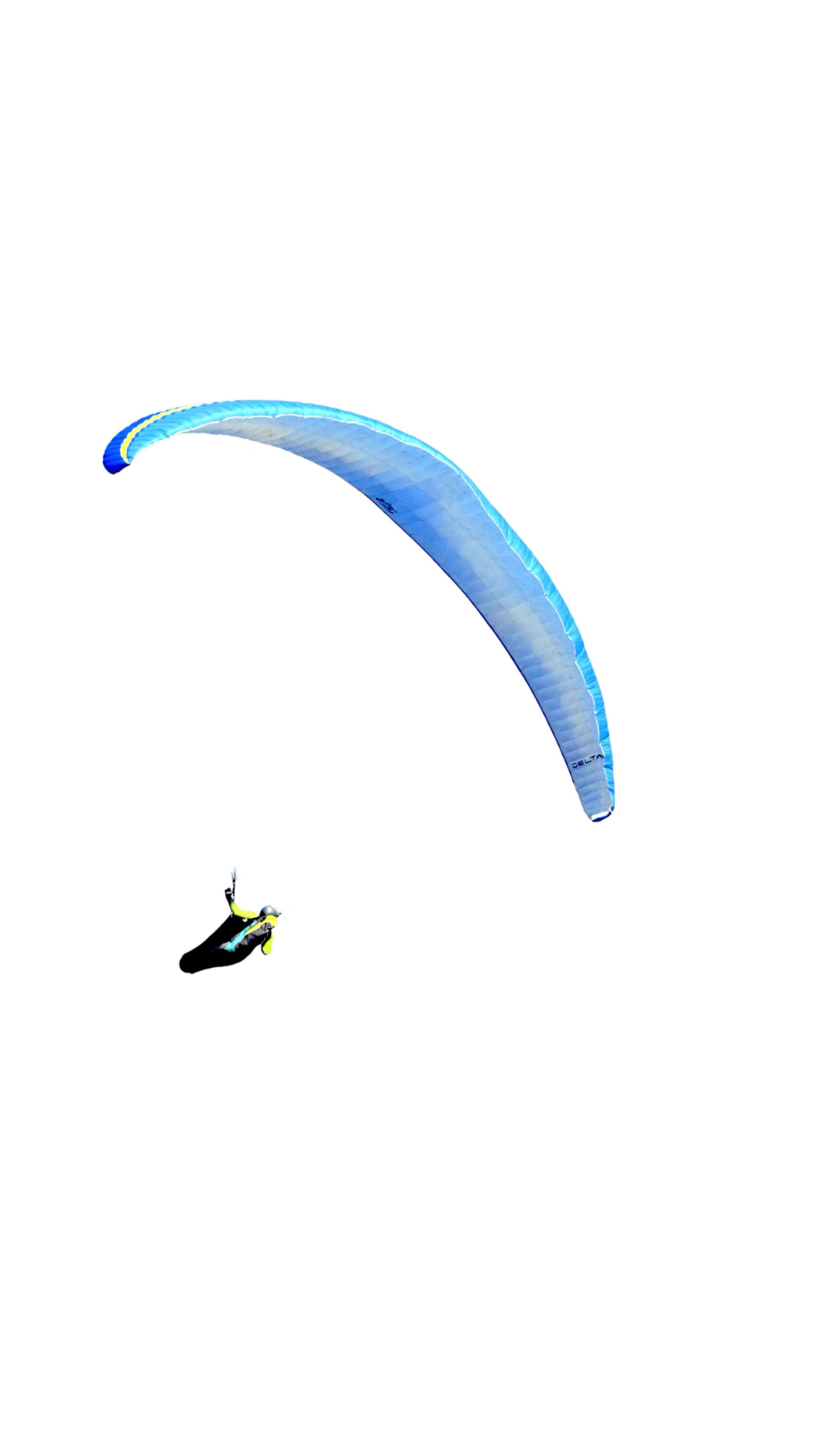 A floating paraglider between the mountains